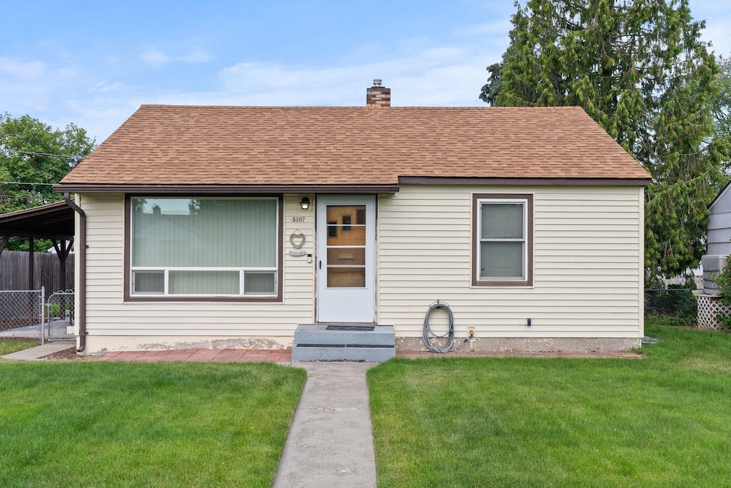 5307 N Elgin St, Spokane, WA 99205 - view of front of property featuring a chimney, a shingled roof, and entry steps