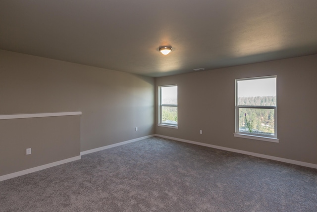 207 E Wandermere Heights Ln, Spokane, WA 99208 - spare room featuring baseboards and dark colored carpet