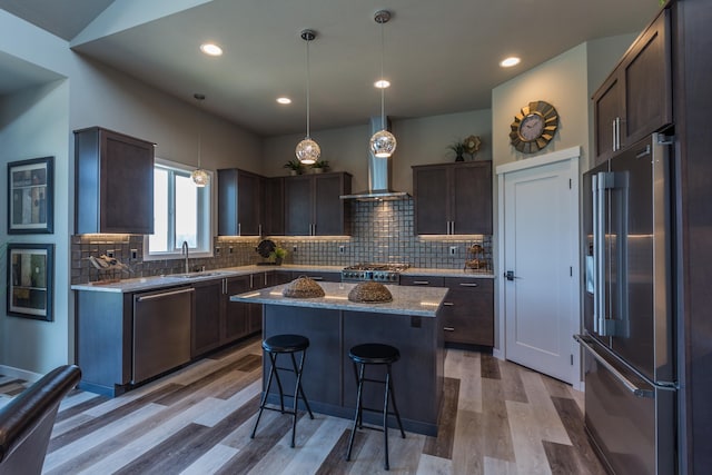 207 E Wandermere Heights Ln, Spokane, WA 99208 - kitchen featuring stainless steel dishwasher, high quality fridge, a sink, dark brown cabinetry, and light wood-type flooring