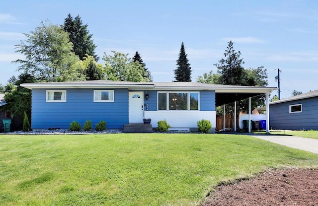 6914 N Jefferson St, Spokane, WA 99208 - view of front of house with concrete driveway, a carport, and a front yard