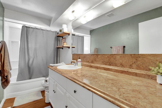 6914 N Jefferson St, Spokane, WA 99208 - full bathroom with vanity, shower / bath combo, wood finished floors, and toilet