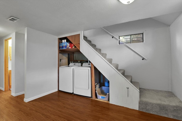 6914 N Jefferson St, Spokane, WA 99208 - finished below grade area with washing machine and clothes dryer, wood finished floors, stairway, and baseboards