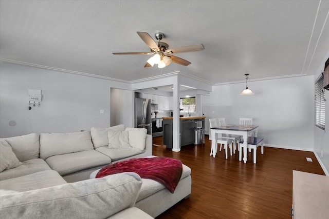 6914 N Jefferson St, Spokane, WA 99208 - living room featuring ceiling fan, dark wood-type flooring, baseboards, and crown molding