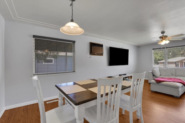 6914 N Jefferson St, Spokane, WA 99208 - dining space with a ceiling fan, wood finished floors, baseboards, and a wall unit AC
