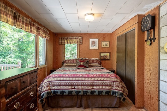 2948 Deep Lake Boundary Rd, Colville, WA 99114 - bedroom with wooden walls, a closet, and wood finished floors