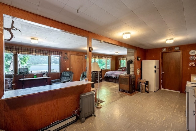 2948 Deep Lake Boundary Rd, Colville, WA 99114 - interior space with healthy amount of natural light, wooden walls, and light floors
