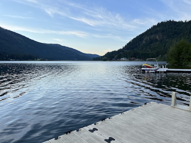2948 Deep Lake Boundary Rd, Colville, WA 99114 - dock area featuring a water and mountain view and a forest view