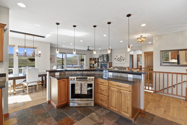 6595D Lois Way, Nine Mile Falls, WA 99026 - kitchen with a chandelier, recessed lighting, pendant lighting, stainless steel electric range oven, and tile countertops
