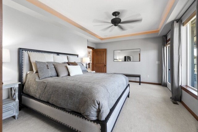 6595D Lois Way, Nine Mile Falls, WA 99026 - bedroom featuring light colored carpet, a raised ceiling, baseboards, and a ceiling fan
