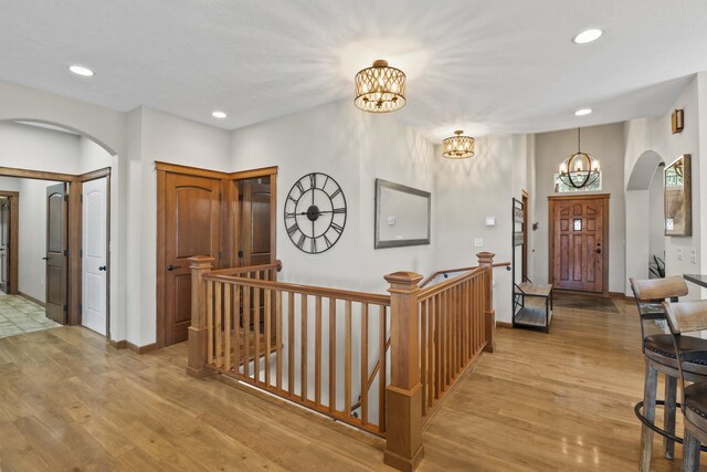 6595D Lois Way, Nine Mile Falls, WA 99026 - entrance foyer featuring arched walkways, a chandelier, light wood-type flooring, recessed lighting, and baseboards