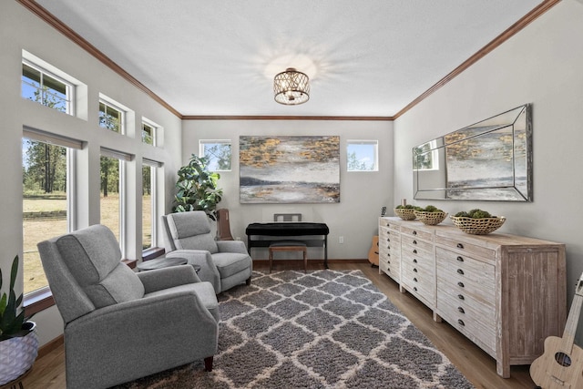 6595D Lois Way, Nine Mile Falls, WA 99026 - living area featuring ornamental molding, plenty of natural light, dark wood-type flooring, and a chandelier