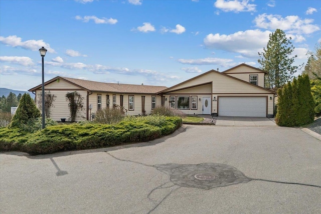 8626 E Sugar Pine Ln, Spokane, WA 99217 - view of front of home with an attached garage and concrete driveway