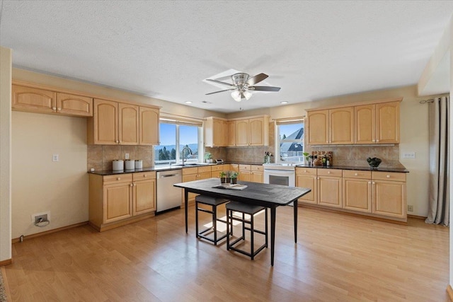 8626 E Sugar Pine Ln, Spokane, WA 99217 - kitchen featuring light brown cabinets, stainless steel dishwasher, ceiling fan, white electric range oven, and light wood finished floors