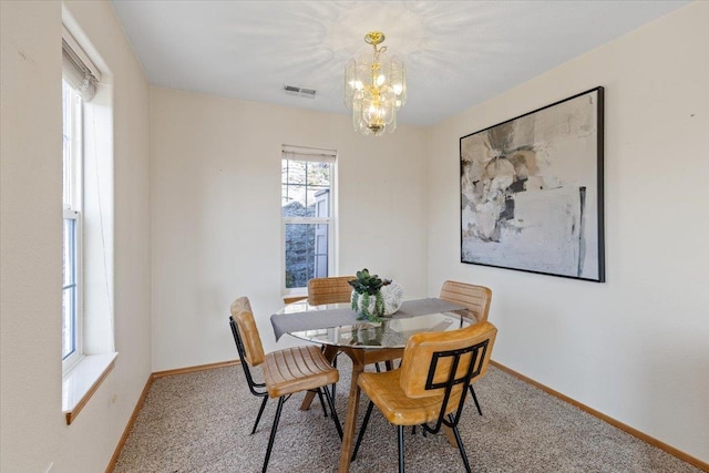 8626 E Sugar Pine Ln, Spokane, WA 99217 - dining room with baseboards, a chandelier, and carpet floors
