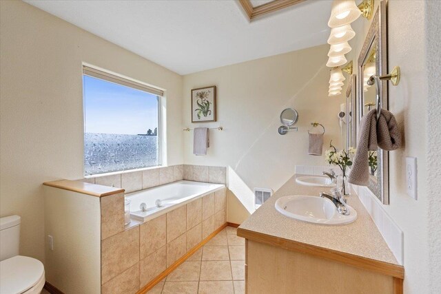 8626 E Sugar Pine Ln, Spokane, WA 99217 - full bathroom with a garden tub, double vanity, toilet, and tile patterned flooring
