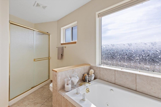 8626 E Sugar Pine Ln, Spokane, WA 99217 - full bathroom featuring toilet, a stall shower, a jetted tub, and tile patterned flooring