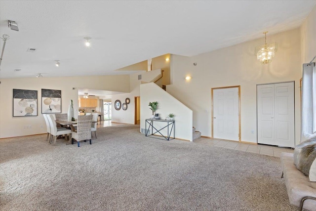 8626 E Sugar Pine Ln, Spokane, WA 99217 - dining space with stairway, light colored carpet, a chandelier, baseboards, and high vaulted ceiling