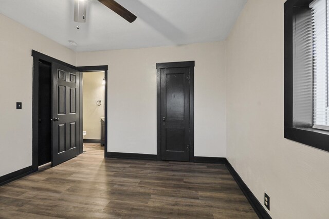 10 S Greenacres Ave, Spokane Valley, WA 99016 - unfurnished bedroom featuring baseboards, wood finished floors, ensuite bath, and a ceiling fan