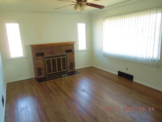 40 E Heroy Ave, Spokane, WA 99207 - unfurnished living room featuring ceiling fan, wood finished floors, a fireplace, and baseboards