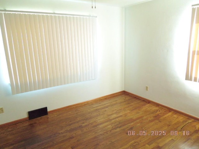 40 E Heroy Ave, Spokane, WA 99207 - unfurnished room with wood finished floors and baseboards