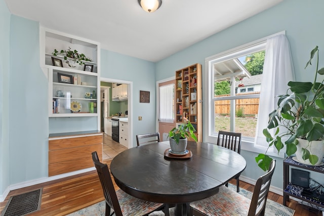 697 N Hofstetter St, Colville, WA 99114 - dining area with light wood-style flooring and baseboards