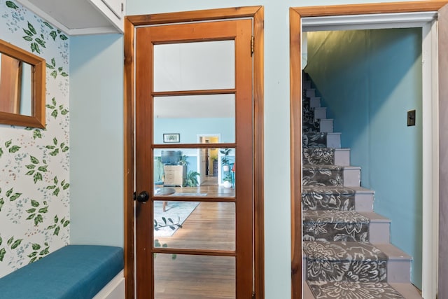 697 N Hofstetter St, Colville, WA 99114 - staircase featuring wood finished floors and wallpapered walls