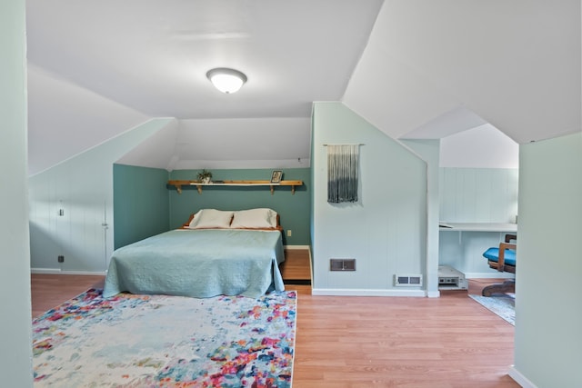 697 N Hofstetter St, Colville, WA 99114 - bedroom with wood finished floors, vaulted ceiling, and baseboards