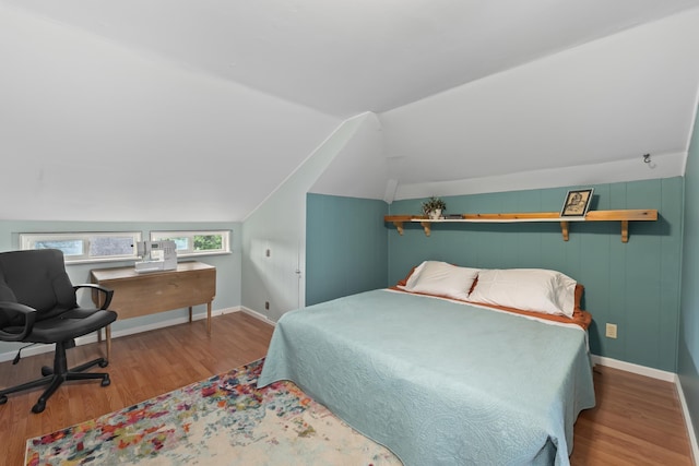 697 N Hofstetter St, Colville, WA 99114 - bedroom featuring wood finished floors, baseboards, and lofted ceiling