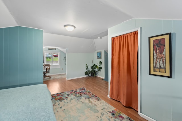 697 N Hofstetter St, Colville, WA 99114 - bedroom with wood finished floors, lofted ceiling, baseboards, and a closet