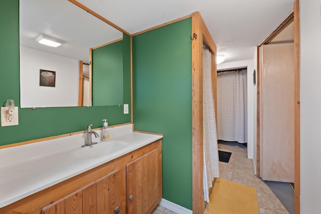 697 N Hofstetter St, Colville, WA 99114 - full bath featuring vanity, a shower with curtain, and tile patterned flooring