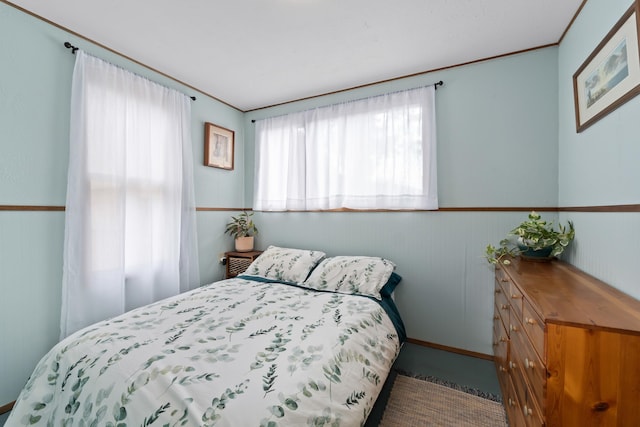 697 N Hofstetter St, Colville, WA 99114 - carpeted bedroom featuring wainscoting