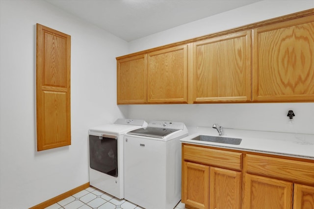 2318 S Steen Rd, Spokane Valley, WA 99037 - washroom featuring cabinet space, washing machine and dryer, and baseboards