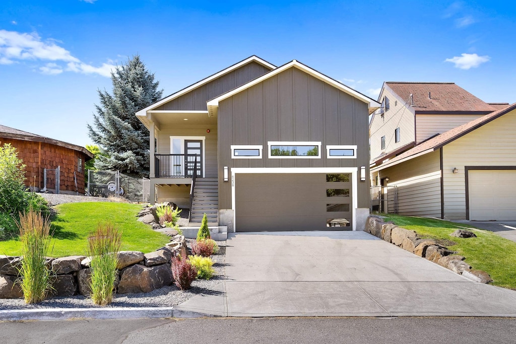 4238 E Congress Ave, Spokane, WA 99223 - view of front of home with board and batten siding and concrete driveway