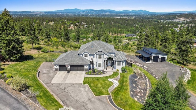10409 E Grouse Mountain Ln, Spokane, WA 99206 - aerial view of property and surrounding area featuring a forest and mountains