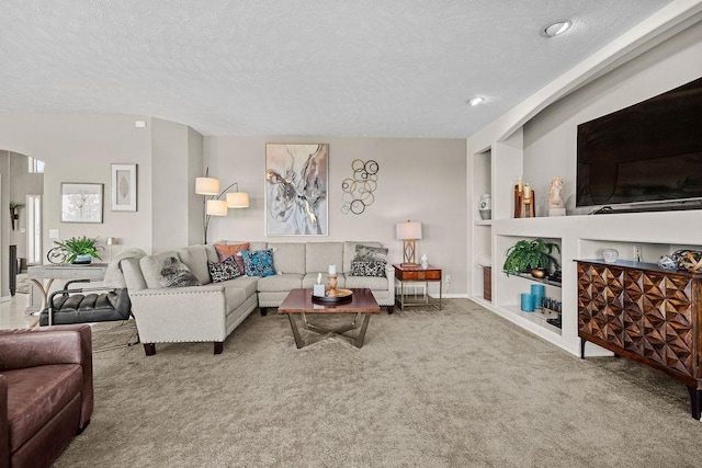 10409 E Grouse Mountain Ln, Spokane, WA 99206 - carpeted living room with a textured ceiling and built in shelves