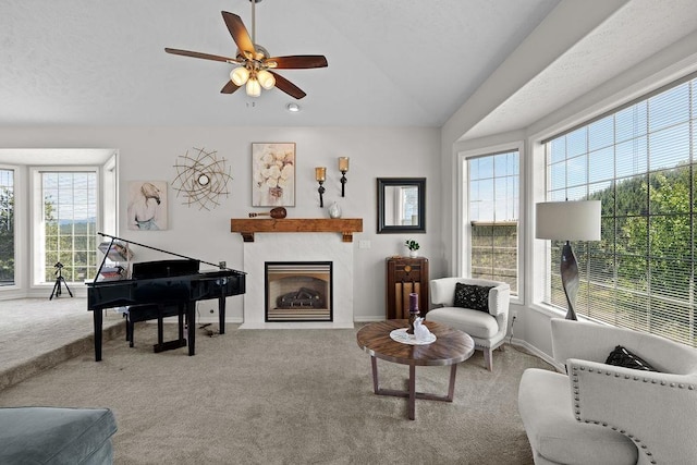 10409 E Grouse Mountain Ln, Spokane, WA 99206 - sitting room featuring carpet flooring, plenty of natural light, vaulted ceiling, ceiling fan, and a fireplace with flush hearth