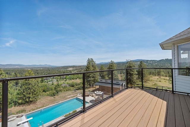 10409 E Grouse Mountain Ln, Spokane, WA 99206 - deck featuring a mountain view and an outdoor pool