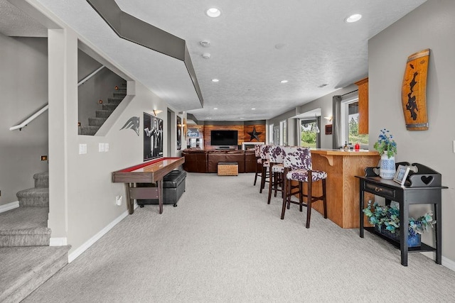 10409 E Grouse Mountain Ln, Spokane, WA 99206 - recreation room featuring light carpet, recessed lighting, baseboards, and bar area