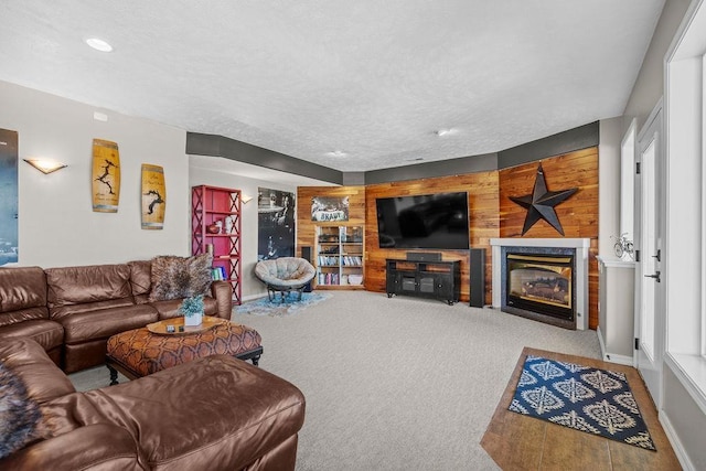 10409 E Grouse Mountain Ln, Spokane, WA 99206 - living area with a fireplace, carpet, recessed lighting, baseboards, and wood walls