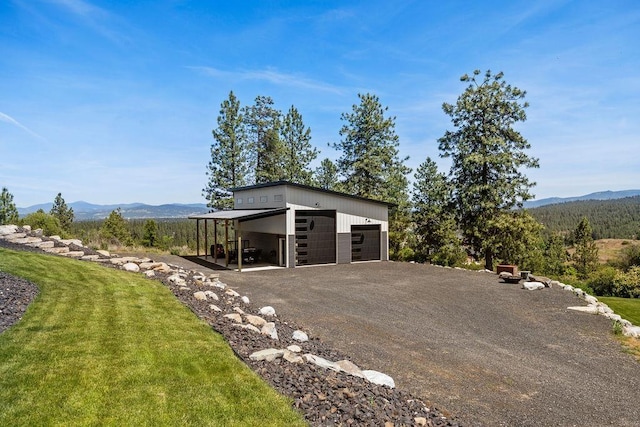 10409 E Grouse Mountain Ln, Spokane, WA 99206 - garage with a mountain view and a detached garage
