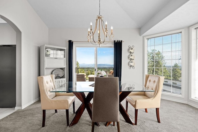 10409 E Grouse Mountain Ln, Spokane, WA 99206 - dining room featuring arched walkways, carpet, a chandelier, vaulted ceiling, and baseboards