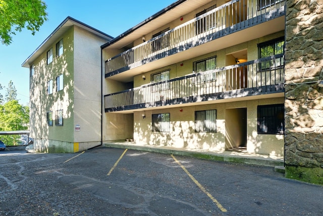 1002 W 7th Ave Unit 302, Spokane, WA 99204 - view of apartment building / complex with uncovered parking