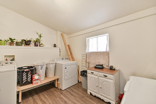 2321 W Boone Ave, Spokane, WA 99201 - laundry area featuring washing machine and dryer, light wood finished floors, and cabinet space