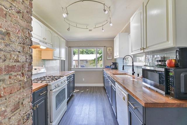 2321 W Boone Ave, Spokane, WA 99201 - kitchen featuring butcher block countertops, white appliances, under cabinet range hood, a sink, and dark wood finished floors