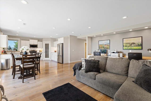 17323 N Lower Greenbluff Rd, Colbert, WA 99005 - living area featuring light wood-type flooring and recessed lighting
