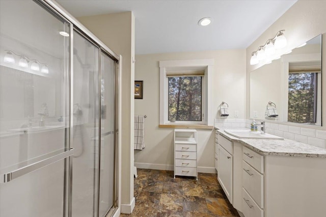 17323 N Lower Greenbluff Rd, Colbert, WA 99005 - bathroom featuring healthy amount of natural light, vanity, a shower stall, baseboards, and recessed lighting