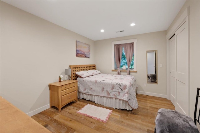17323 N Lower Greenbluff Rd, Colbert, WA 99005 - bedroom with baseboards, light wood finished floors, recessed lighting, and a closet