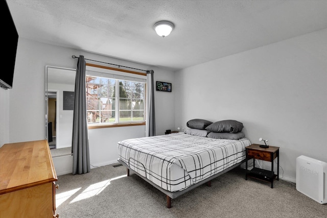 10104 E 13th Ave, Spokane Valley, WA 99206 - carpeted bedroom with a textured ceiling and baseboards
