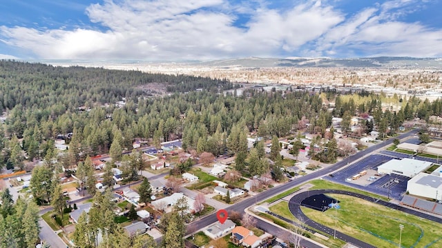 10104 E 13th Ave, Spokane Valley, WA 99206 - aerial view of property's location featuring a heavily wooded area and a mountainous background