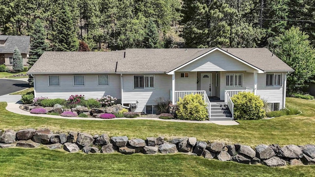 3404 W Excell Ave, Spokane, WA 99208 - single story home featuring covered porch, a front lawn, and roof with shingles